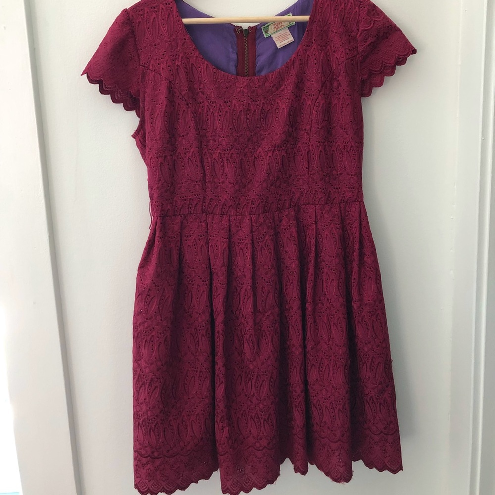 Raspberry red lace dress with scalloped hem and cap sleeve.